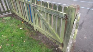 Paint fencing around school playground Volunteer